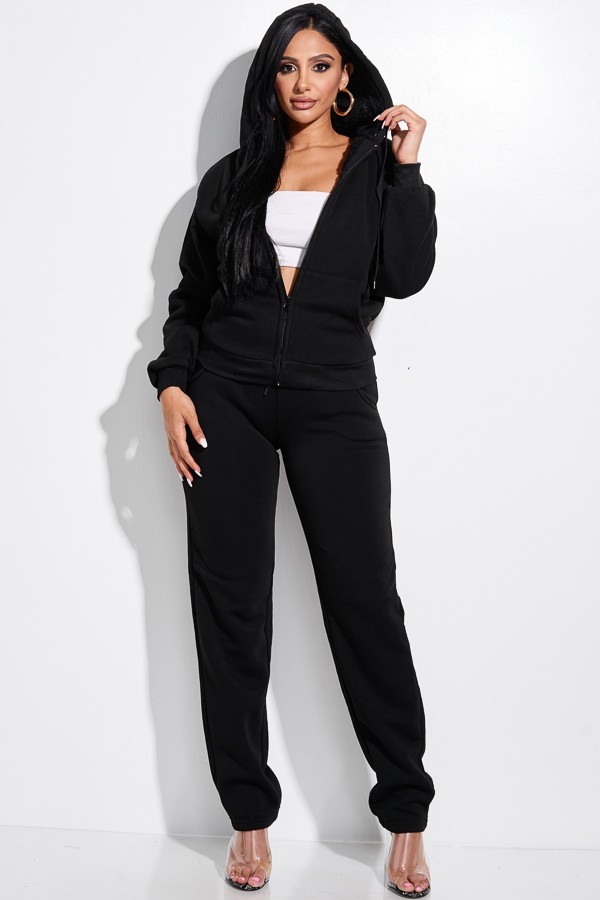 Photograph of model wearing black Jasmine hooded jogging tracksuit.