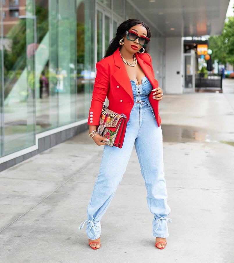 Photograph of model in red fitted blazer by So SR! New York.